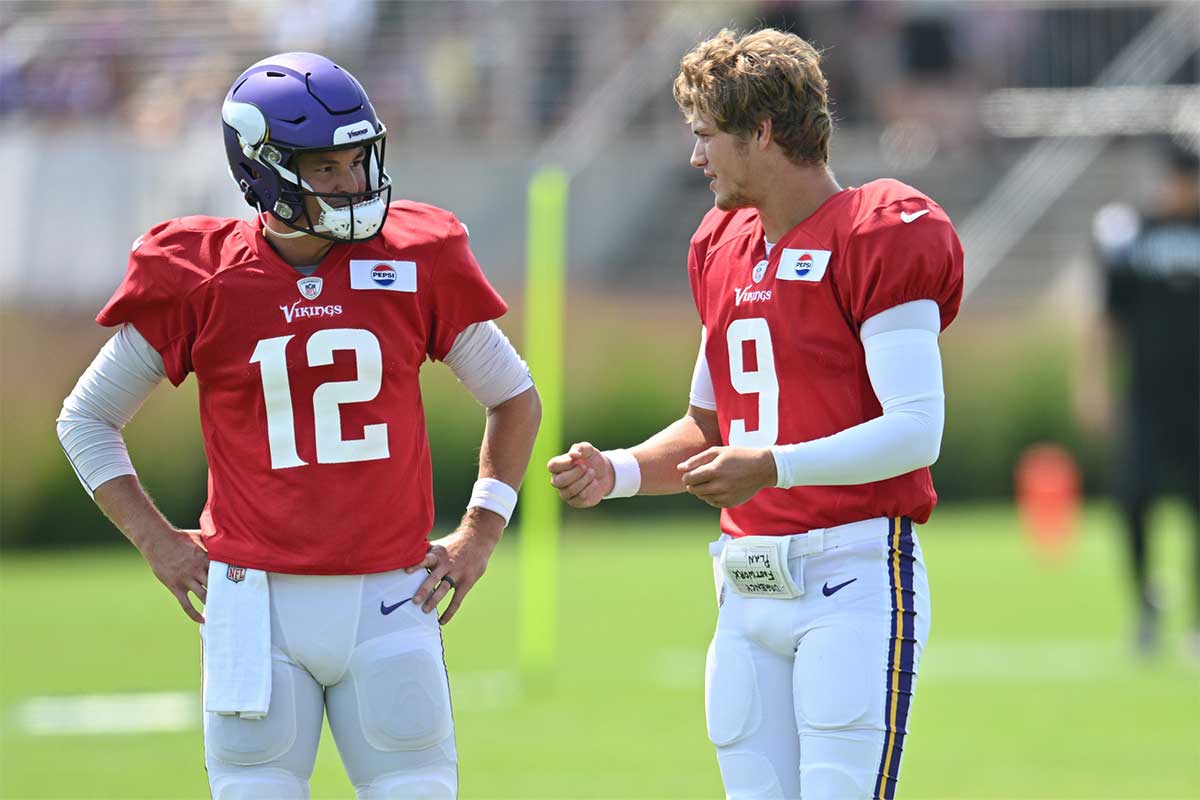 Minnesota Vikings quarterback Nick Mullens (12) and quarterback J.J. McCarthy (9) talk during practice at Vikings training camp in Eagan, MN. 