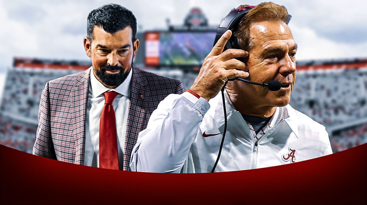 Ohio State football head coach Ryan Day next to former Alabama head coach Nick Saban.
