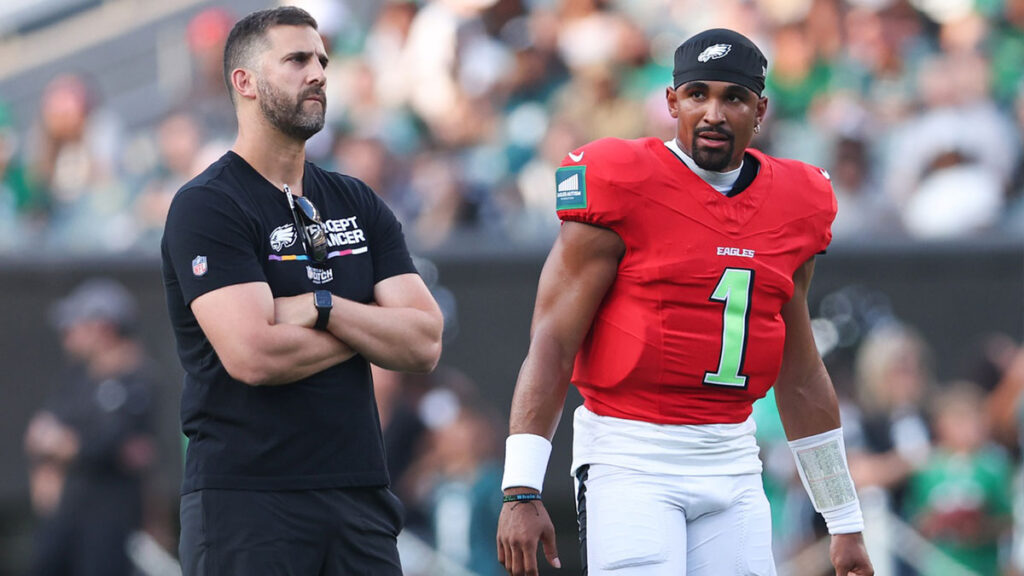 Philadelphia Eagles quarterback Jalen Hurts (1) talks with head coach Nick Sirianni (L) during a practice at Lincoln Financial Field