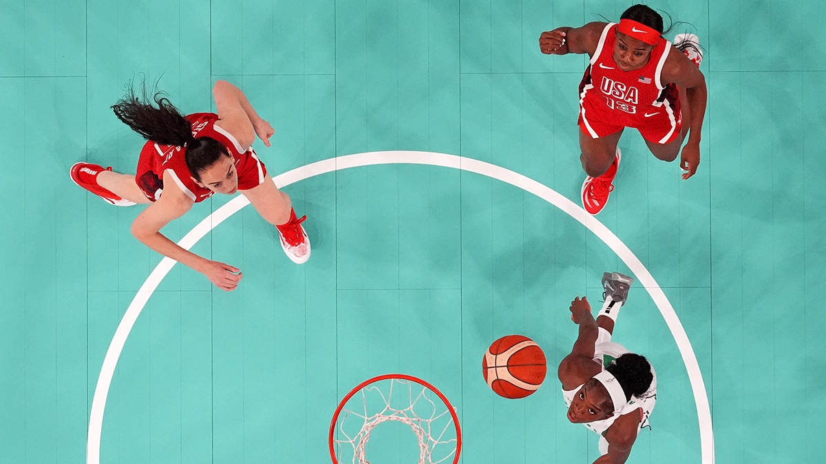 Nigeria point guard Promise Amukamara (10) shoots the ball against United States guard Jackie Young (13) and power forward Breanna Stewart (10) in the women’s basketball quarterfinals during the Paris 2024 Olympic Summer Games.