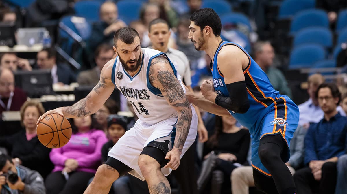 Minnesota Timberwolves center Nikola Pekovic (14) dribbles in the second quarter against the Oklahoma City Thunder center Enes Kanter (11) at Target Center.