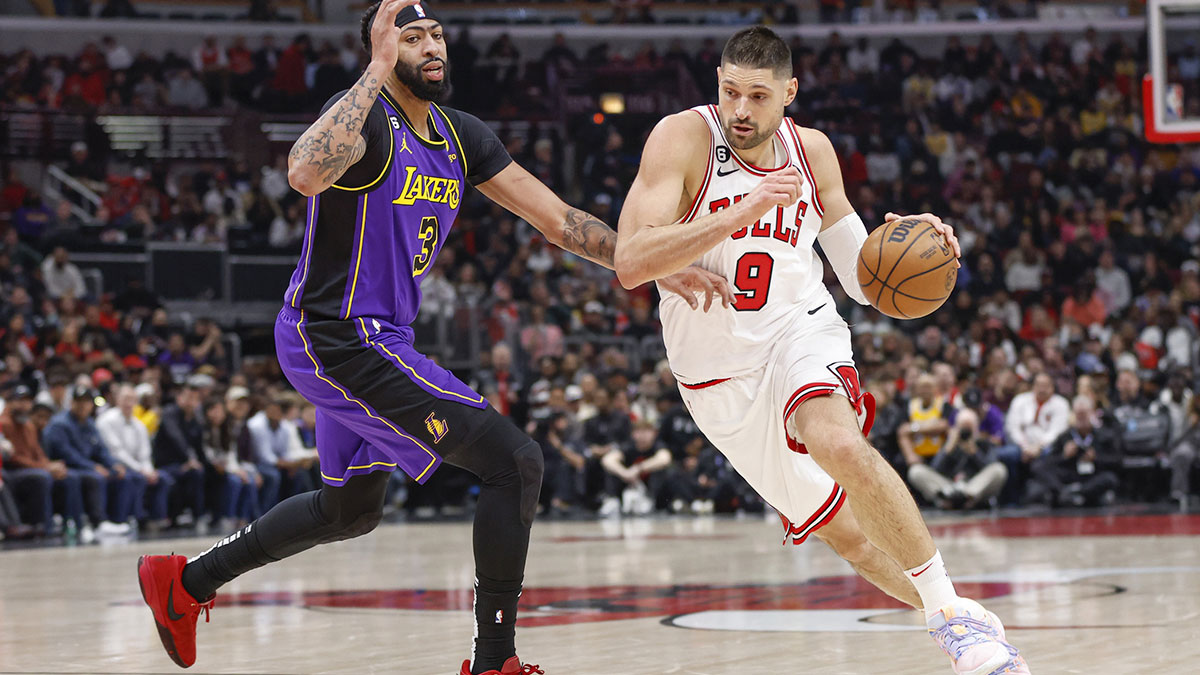 Chicago Bulls center Nikola Vucevic (9) drives to the basket against Los Angeles Lakers forward Anthony Davis (3) during the first half at United Center. 