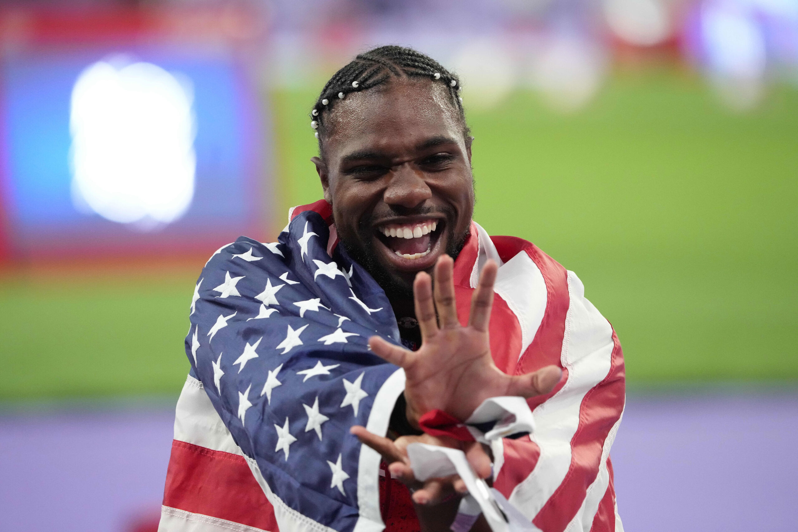 Noah Lyles (USA) celebrates winning the men's 100m final during the Paris 2024 Olympic Summer Games at Stade de France.