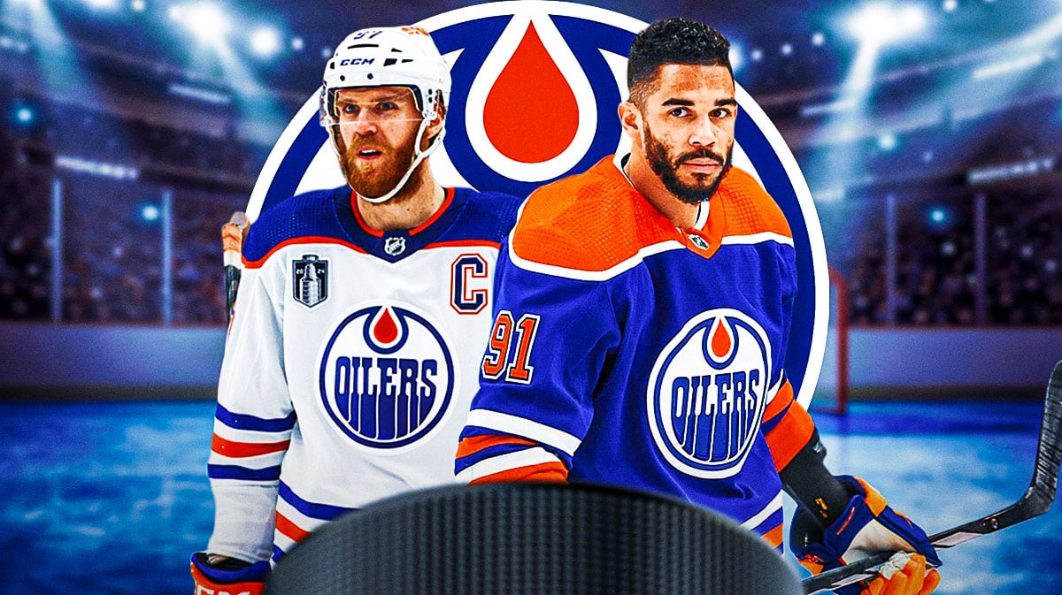 Evander Kane and Connor McDavid in front of Oilers logo