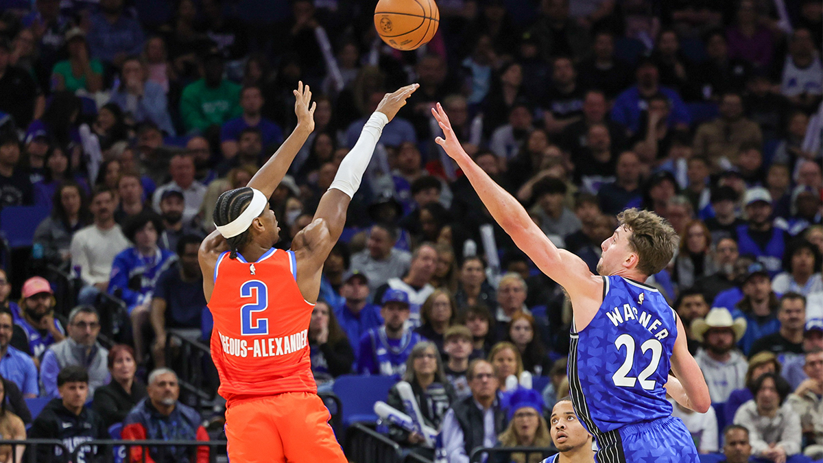 Oklahoma City Thunder guard Shai Gilgeous-Alexander (2) shoots the ball against Orlando Magic forward Franz Wagner (22) during the second quarter at Amway Center.