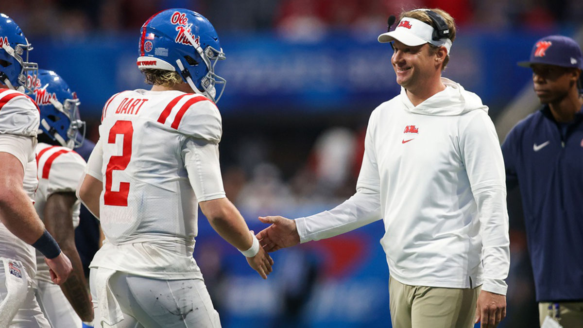 Mississippi Rebels head coach Lane Kiffin celebrates with quarterback Jaxson Dart (2) after a touchdown against the Penn State Nittany Lions in the second half at Mercedes-Benz Stadium.