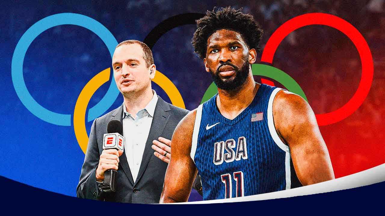 Tim Bontemps next to Olympics Joel Embiid with the Olympic rings behind them.