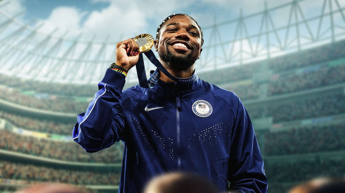 Team USA's Noah Lyles smiling while wearing his gold medal