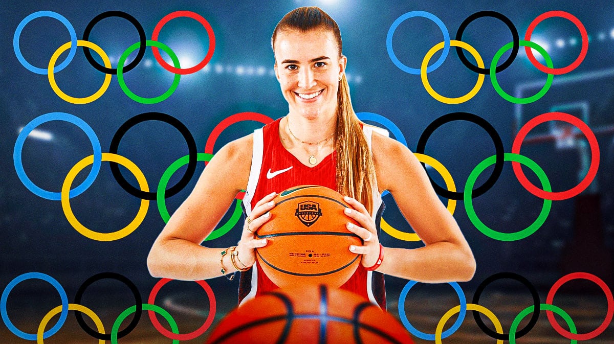 Sabrina Ionescu in a Team USA jersey with the Olympic symbol in the background.