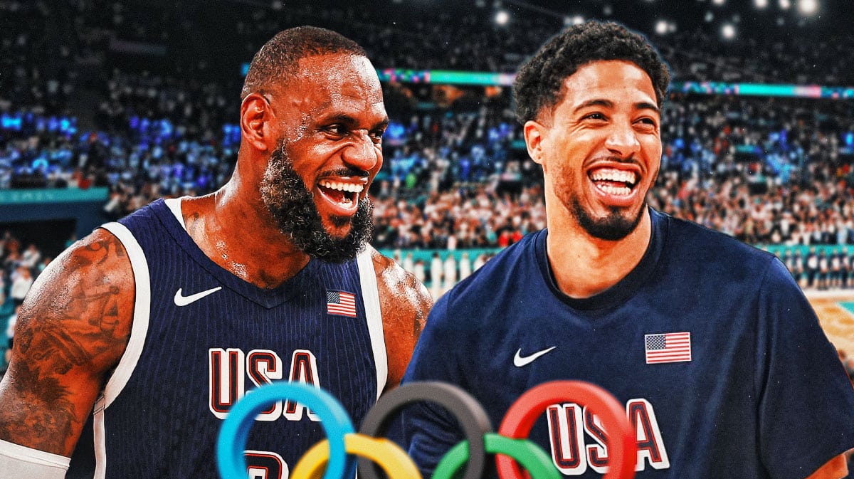 Tyrese Haliburton and LeBron James smile next to each other in usa jerseys