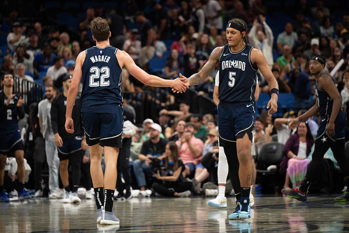 Orlando Magic forward Paolo Banchero (5) celebrates with Orlando Magic forward Franz Wagner (22) in the fourth quarter against the Toronto Raptors at KIA Center.