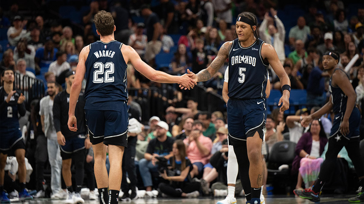 Orlando Magic forward Paolo Banchero (5) celebrates with Orlando Magic forward Franz Wagner (22) in the fourth quarter against the Toronto Raptors at KIA Center.