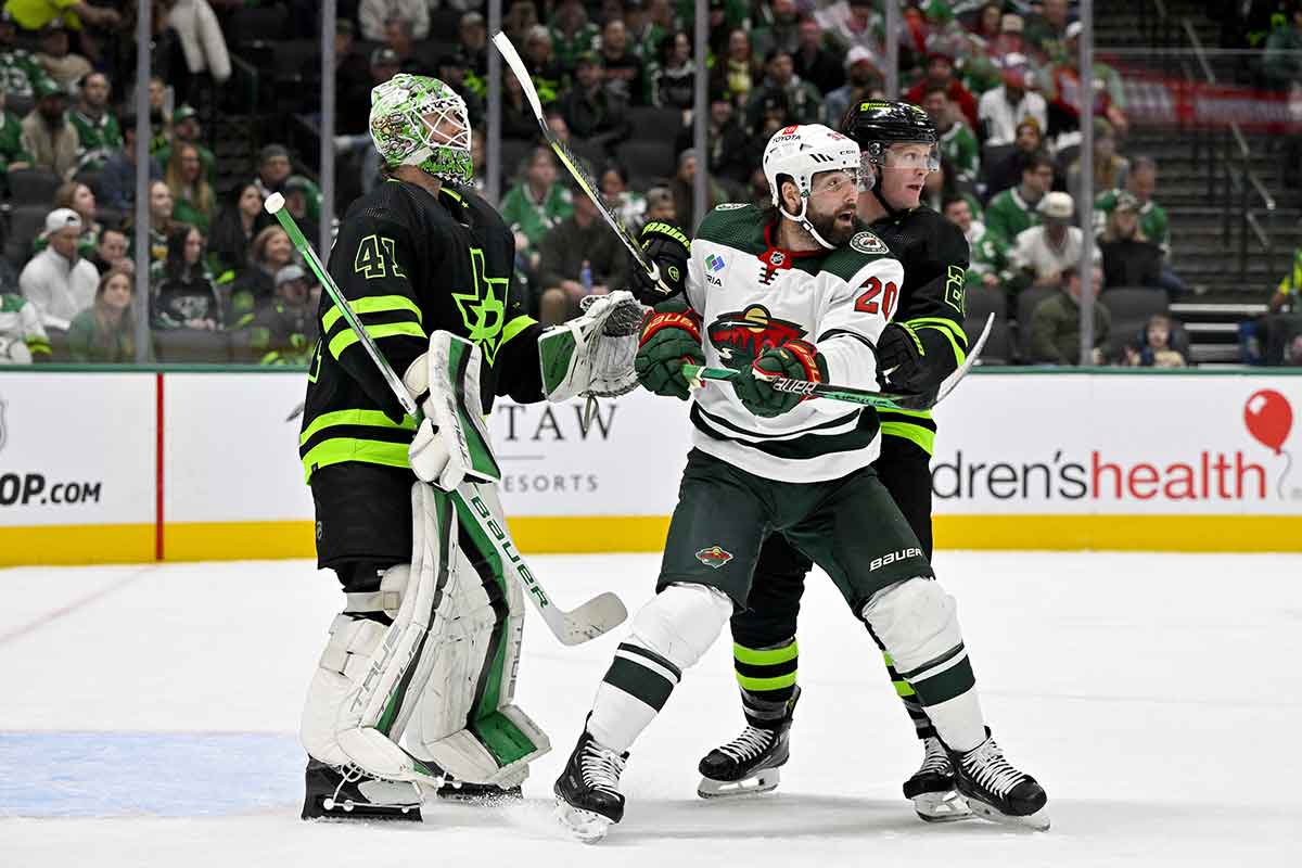 Minnesota Wild left wing Pat Maroon (20) and Dallas Stars defenseman Ryan Suter (20) look for the puck in front of goaltender Scott Wedgewood (41) during the first period at the American Airlines Center.