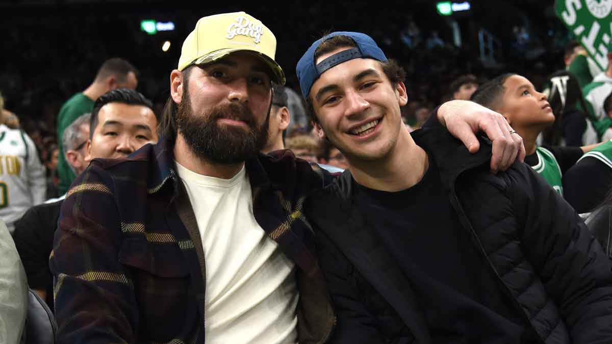 Boston Bruins players Pat Maroon and Matt Poitras pose for a photo during the second half in a game between the Boston Celtics and Phoenix Suns at TD Garden. 