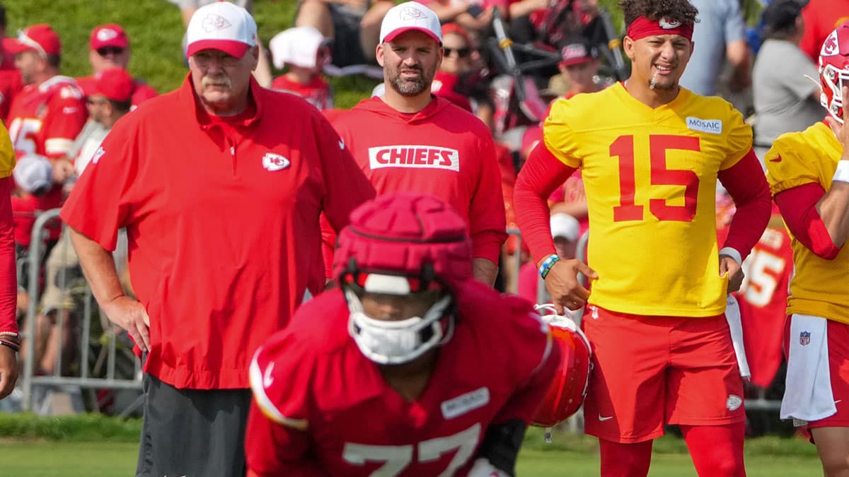 Kansas City Chiefs head coach Andy Reid and quarterback Patrick Mahomes (15) look on during training camp at Missouri Western State University. 