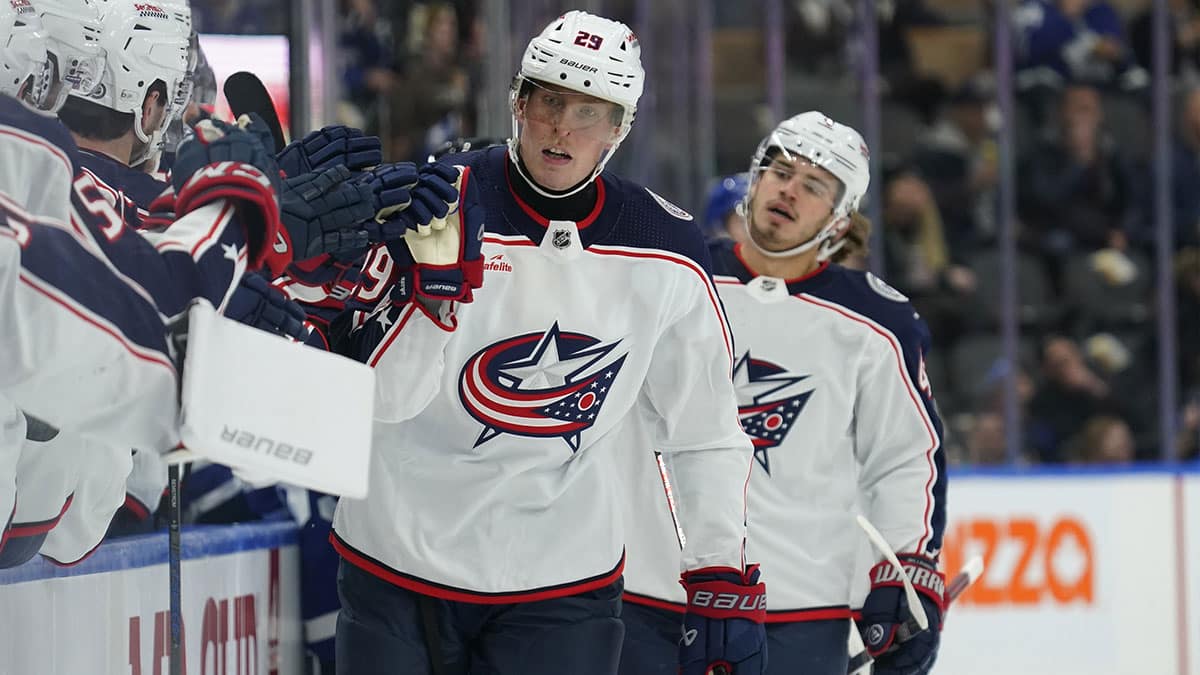 Columbus Blue Jackets forward Patrik Laine (29) gets congratulated after scoring against the Toronto Maple Leafs during the first period at Scotiabank Arena.