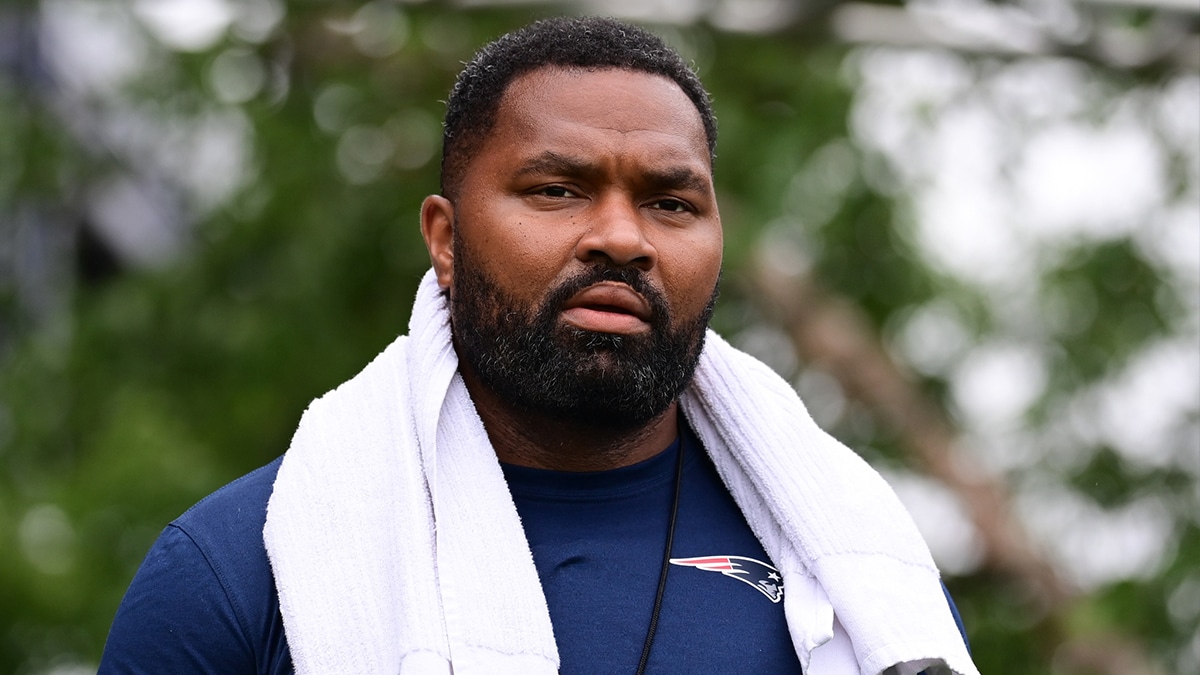 New England Patriots head coach Jerod Mayo walks to the podium for a press conference before training camp at Gillette Stadium.