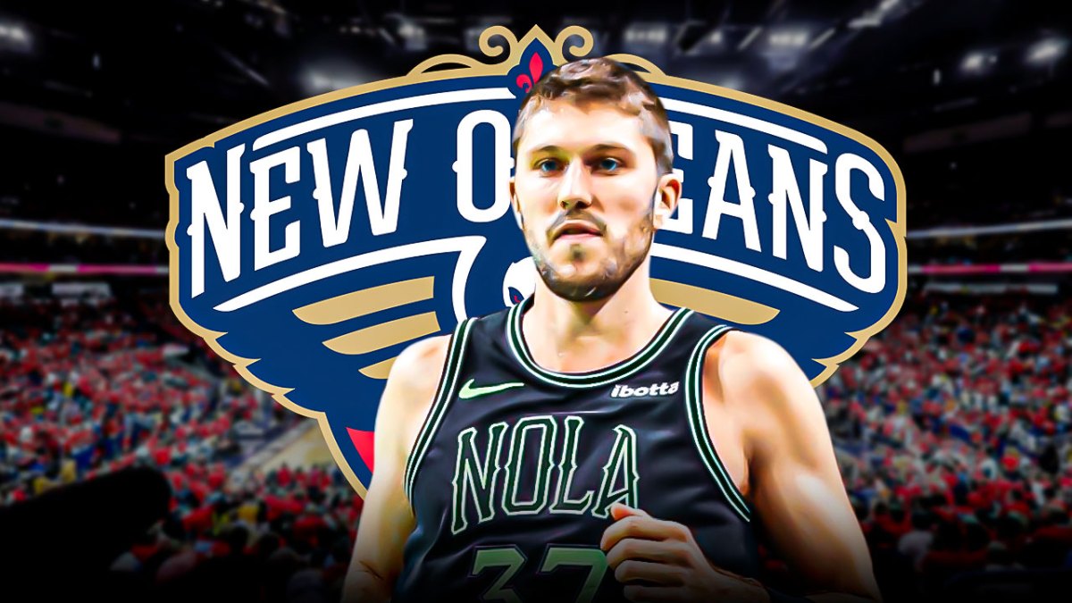 Pelicans' Matt Ryan in front of roster and crowd, Zion Williamson, Brandon Ingram on bench
