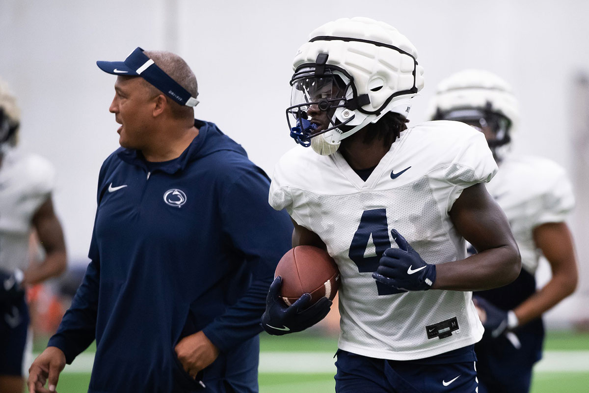 Penn State wide receiver Tyseer Denmark holds onto a football during a practice session inside Holuba Hall on Saturday, August 3, 2024, in State College.