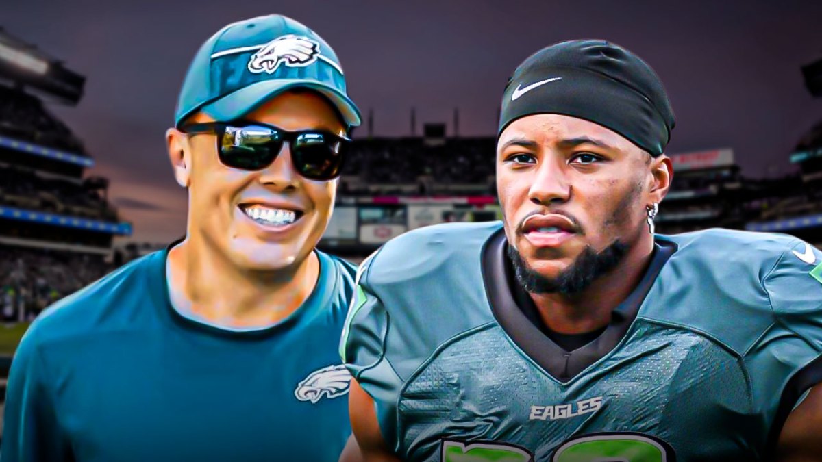 Saquon Barkley and Kellen Moore - both in their Eagles gear - in front of Lincoln Financial Field.