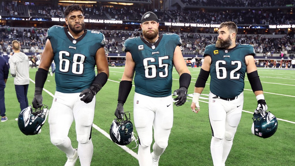 Philadelphia Eagles offensive tackle Jordan Mailata (68) and offensive tackle Lane Johnson (65) and center Jason Kelce (62) walk off the field after the game against the Dallas Cowboys at AT&T Stadium.