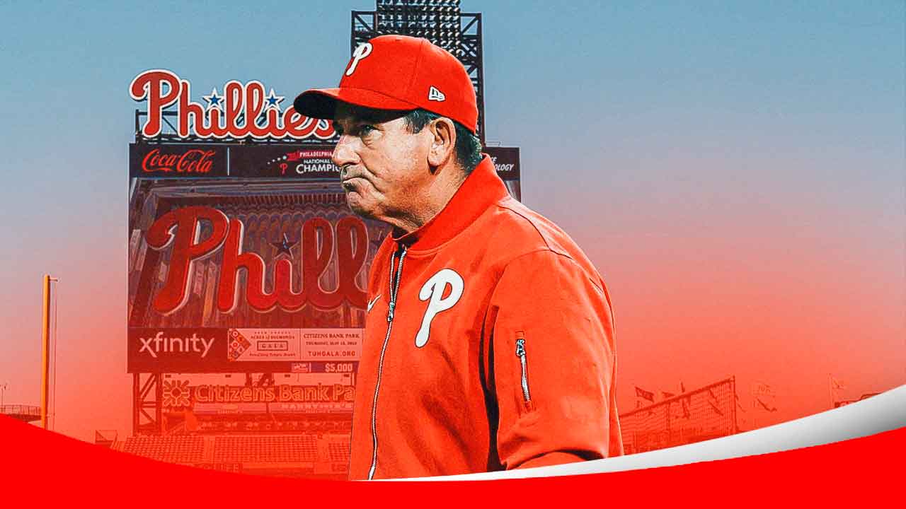 Phillies manager Rob Thomson frowns in Phillies gear