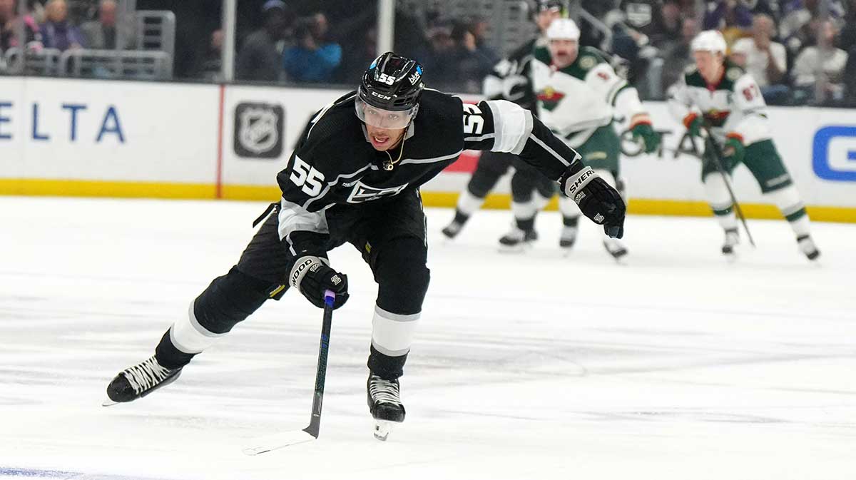 LA Kings right wing Quinton Byfield (55) skates with the puck against the Minnesota Wild in the second period at Crypto.com Arena.