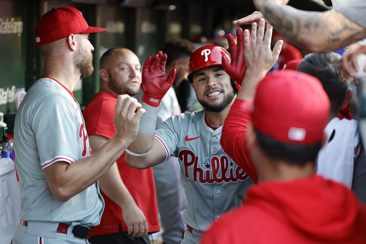 Philadelphia Phillies catcher Rafael Marchan (13) celebrates with teammates after hitting a solo home run against the Chicago Cubs during the third inning at Wrigley Field.