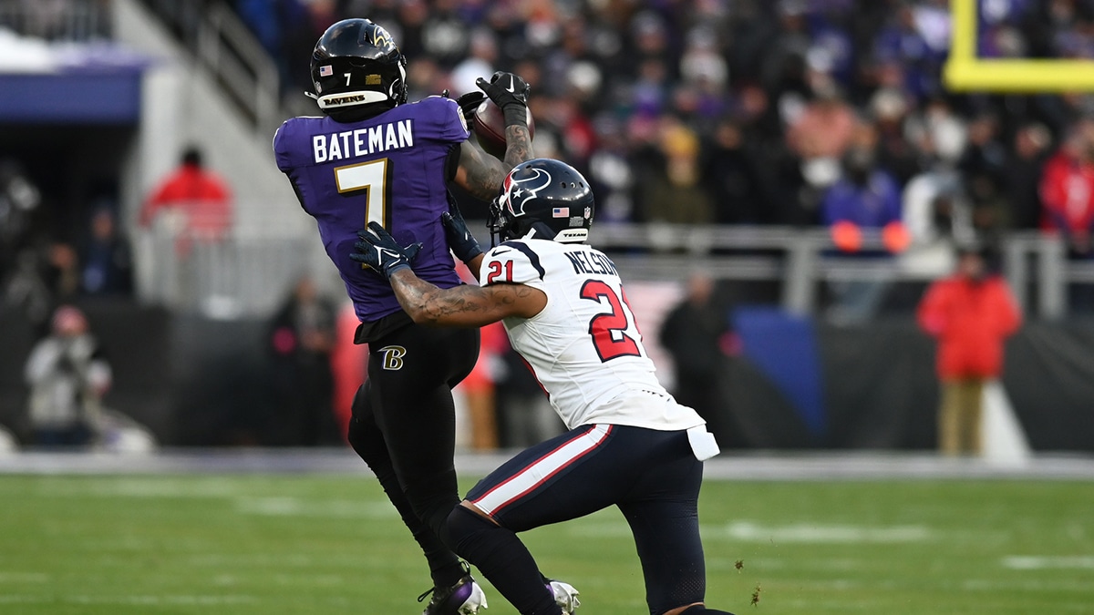 Jan 20, 2024; Baltimore, MD, USA; Baltimore Ravens wide receiver Rashod Bateman (7) catches a pass against Houston Texans cornerback Steven Nelson (21) in the first quarter of a 2024 AFC divisional round game at M&T Bank Stadium. Mandatory Credit: Tommy Gilligan-USA TODAY Sports