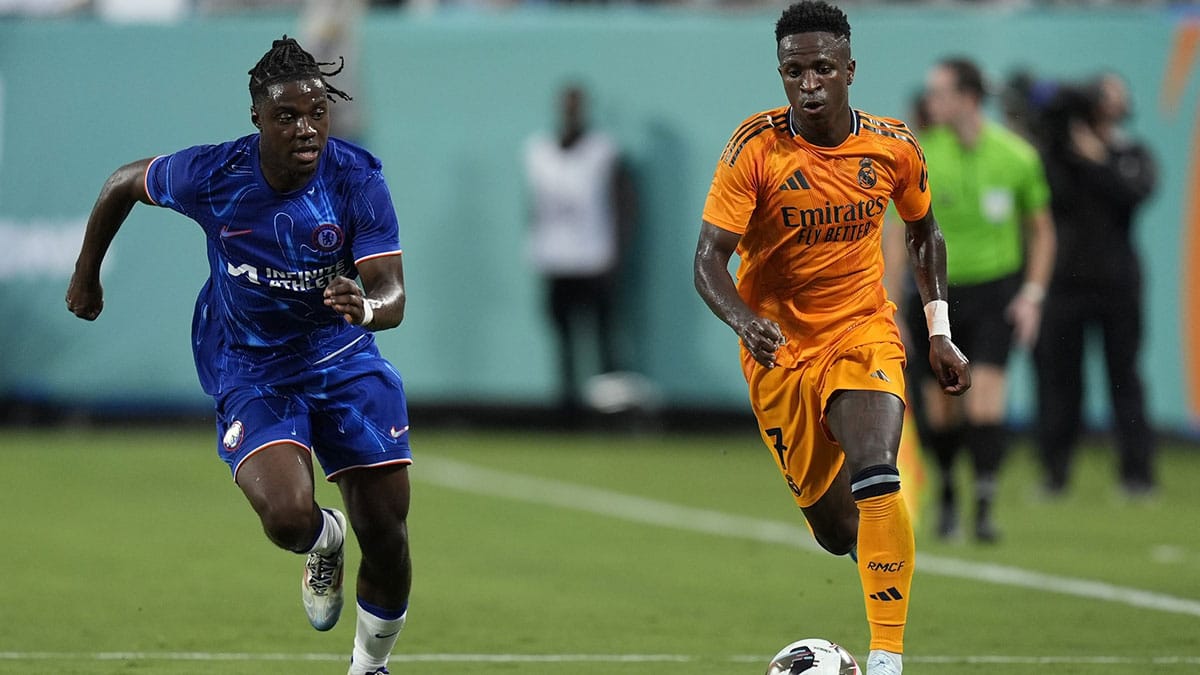 Chelsea midfielder Romeo Lavia (45) gives chase to Real Madrid forward Vinicius Junior (7) during the first half at Bank of America Stadium. 