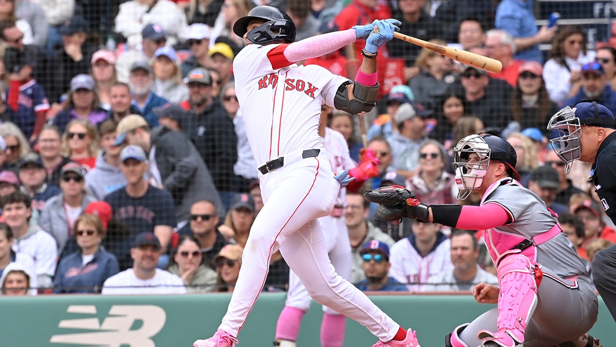 Boston Red Sox second baseman Vaughn Grissom (5) hits a single against the Washington Nationals during the sixth inning at Fenway Park.