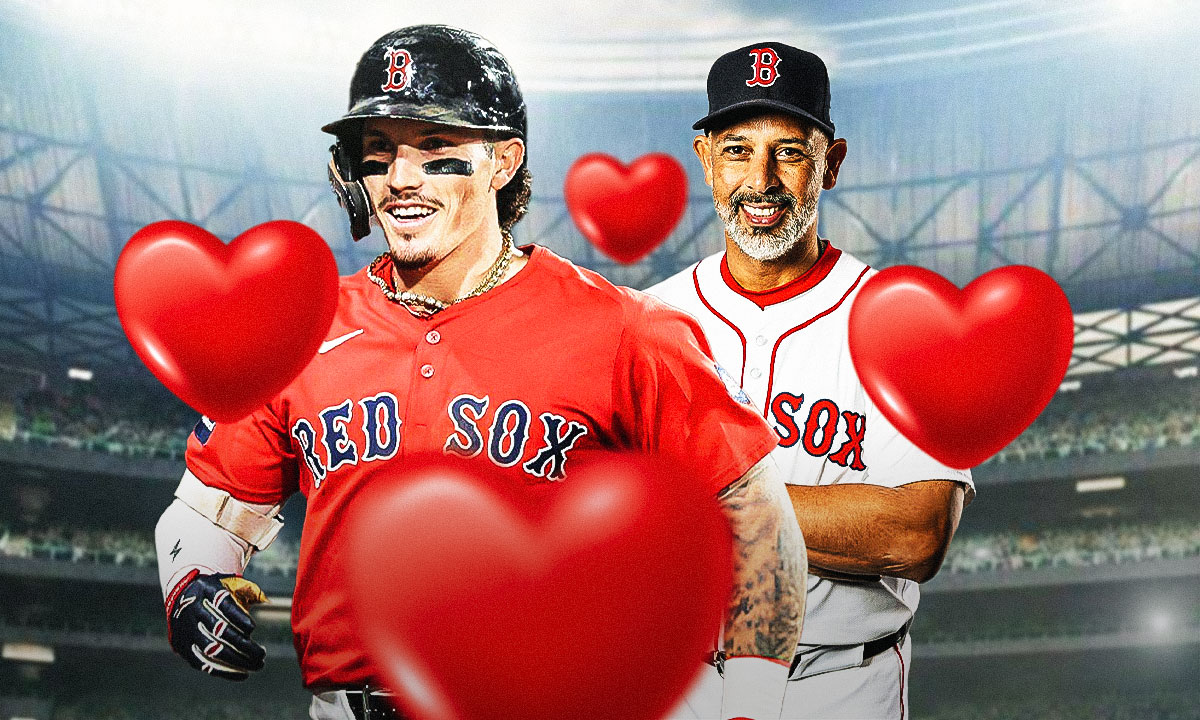 Red Sox's Alex Cora with hearts all over him while smiling at Jarren Duran
