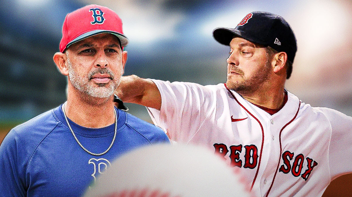 Boston Red Sox manager Alex Cora looking at pitcher Rich Hill