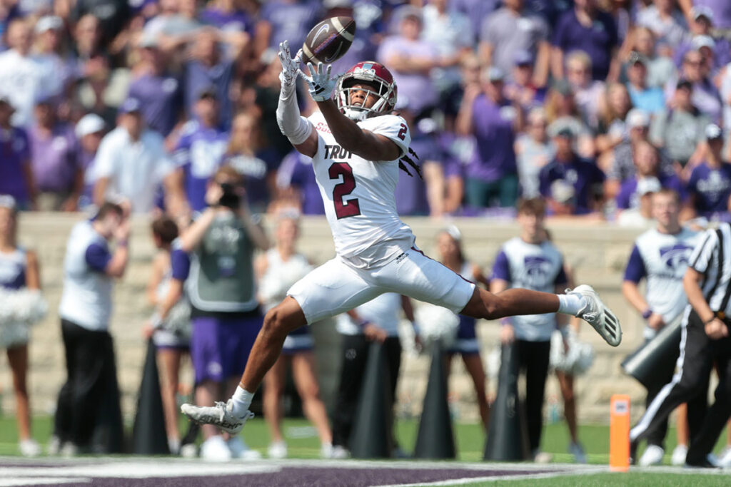 Troy senior cornerback Reddy Steward (2) catches an interception against Kansas State in the second quarter of Saturday's game inside Bill Snyder Family Stadium.