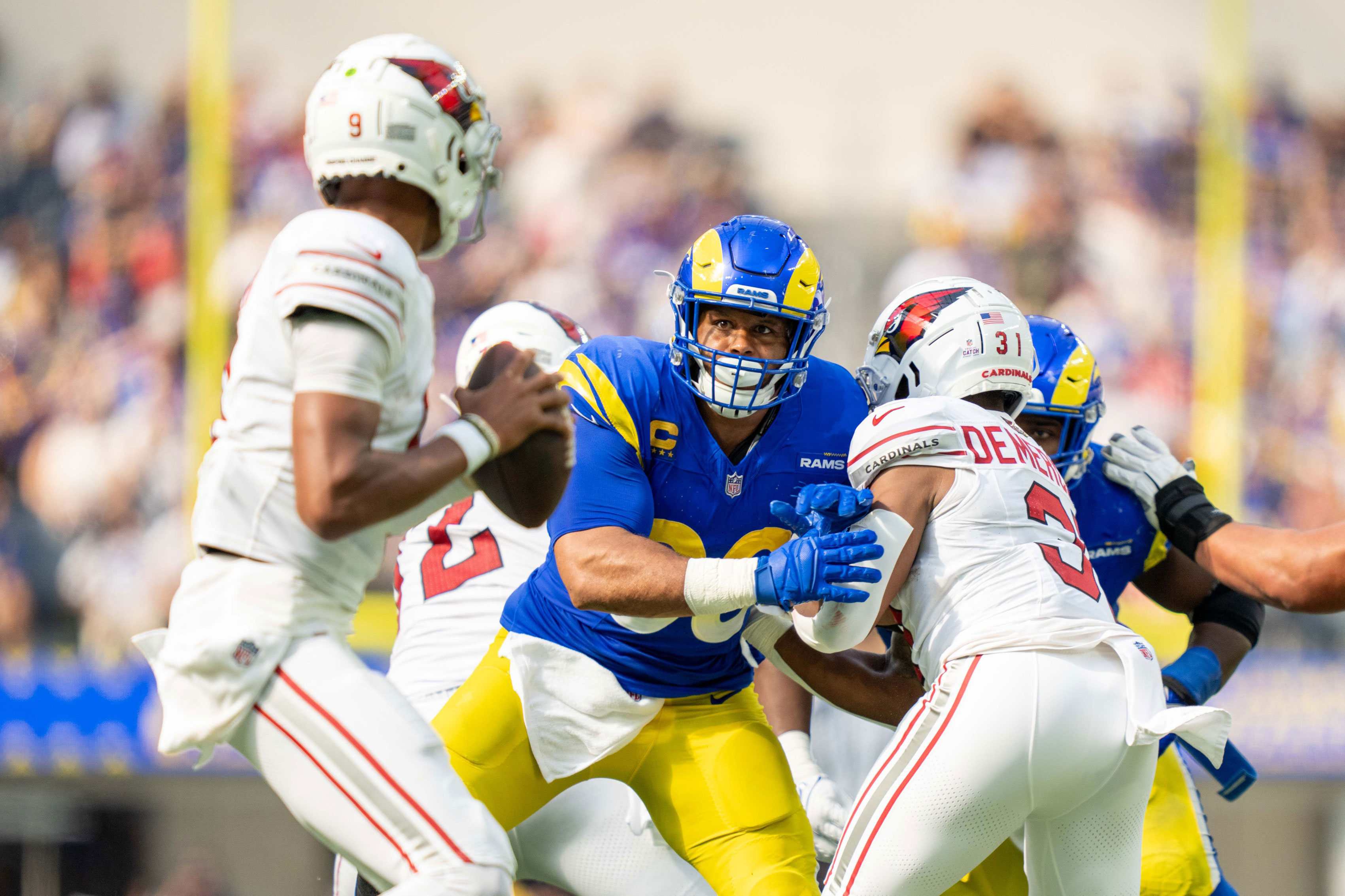 Los Angeles Rams defensive tackle Aaron Donald (99) rushes during the second quarter against the Arizona Cardinals at SoFi Stadium.