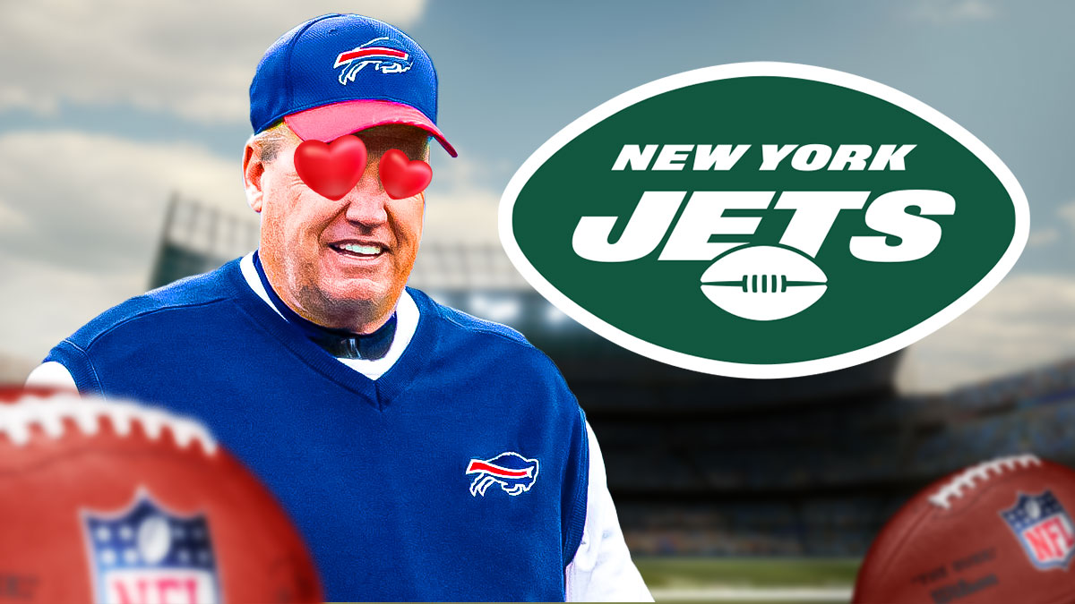 Rex Ryan looks at Jets logo with heart eyes