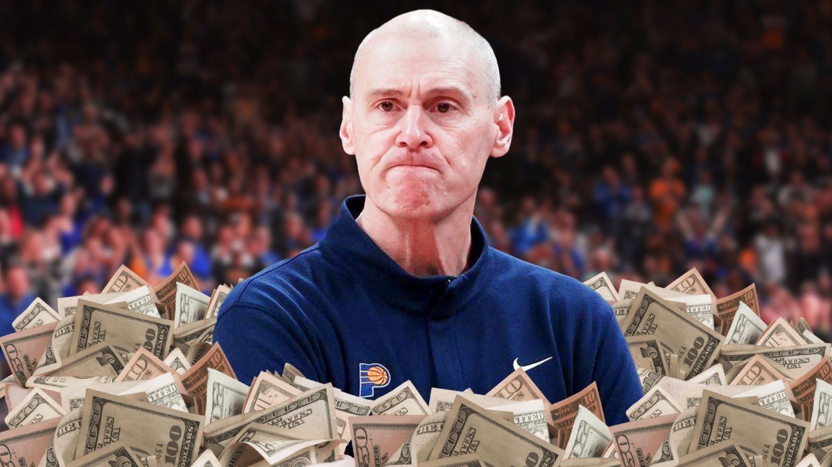 Rick Carlisle with a pile of money.