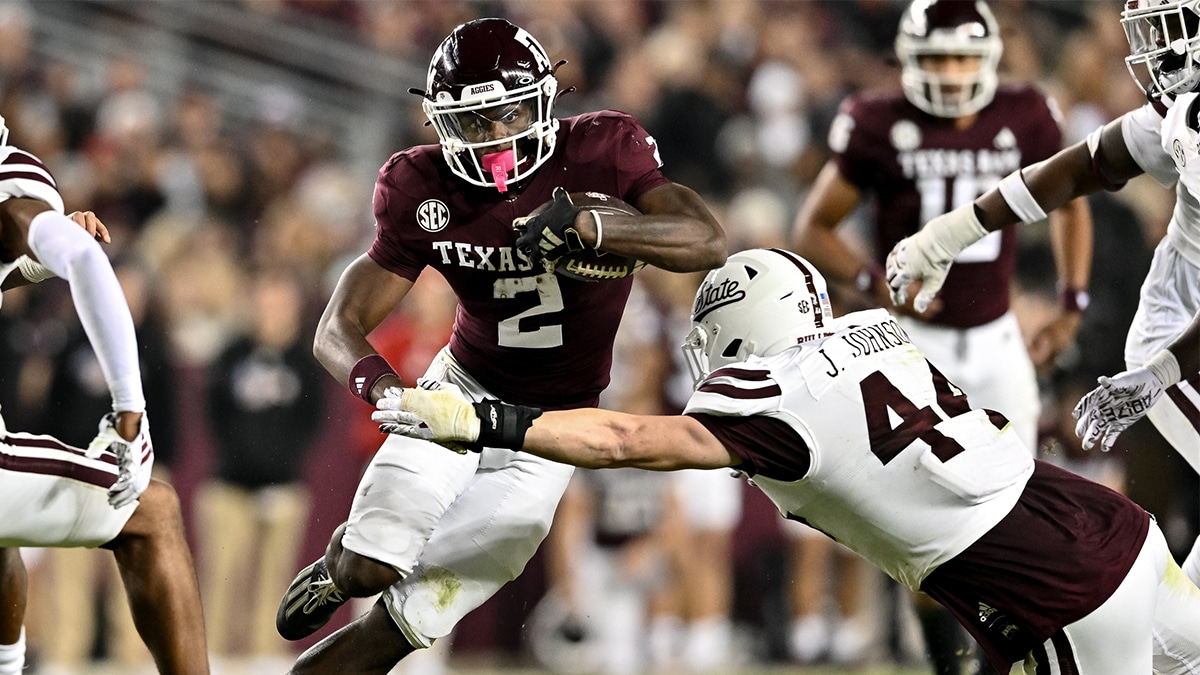 Texas A&M Aggies running back Rueben Owens (2) runs the ball during the second half as Mississippi State Bulldogs linebacker Jett Johnson (44) defends at Kyle Field.