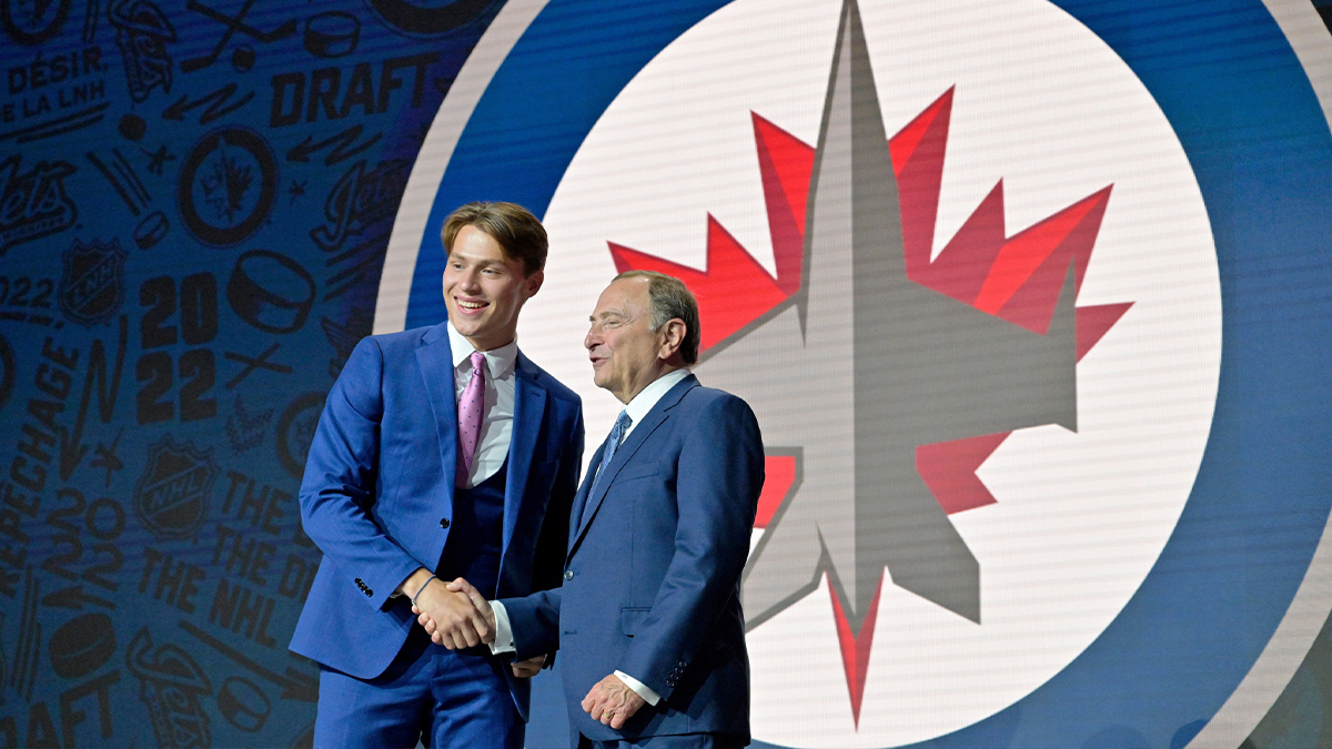 Rutger Mcgroarty shakes hands with NHL commissioner Gary Bettman after being selected as the number fourteen overall pick to the Winnepeg Jets in the first round of the 2022 NHL Draft at Bell Centre.