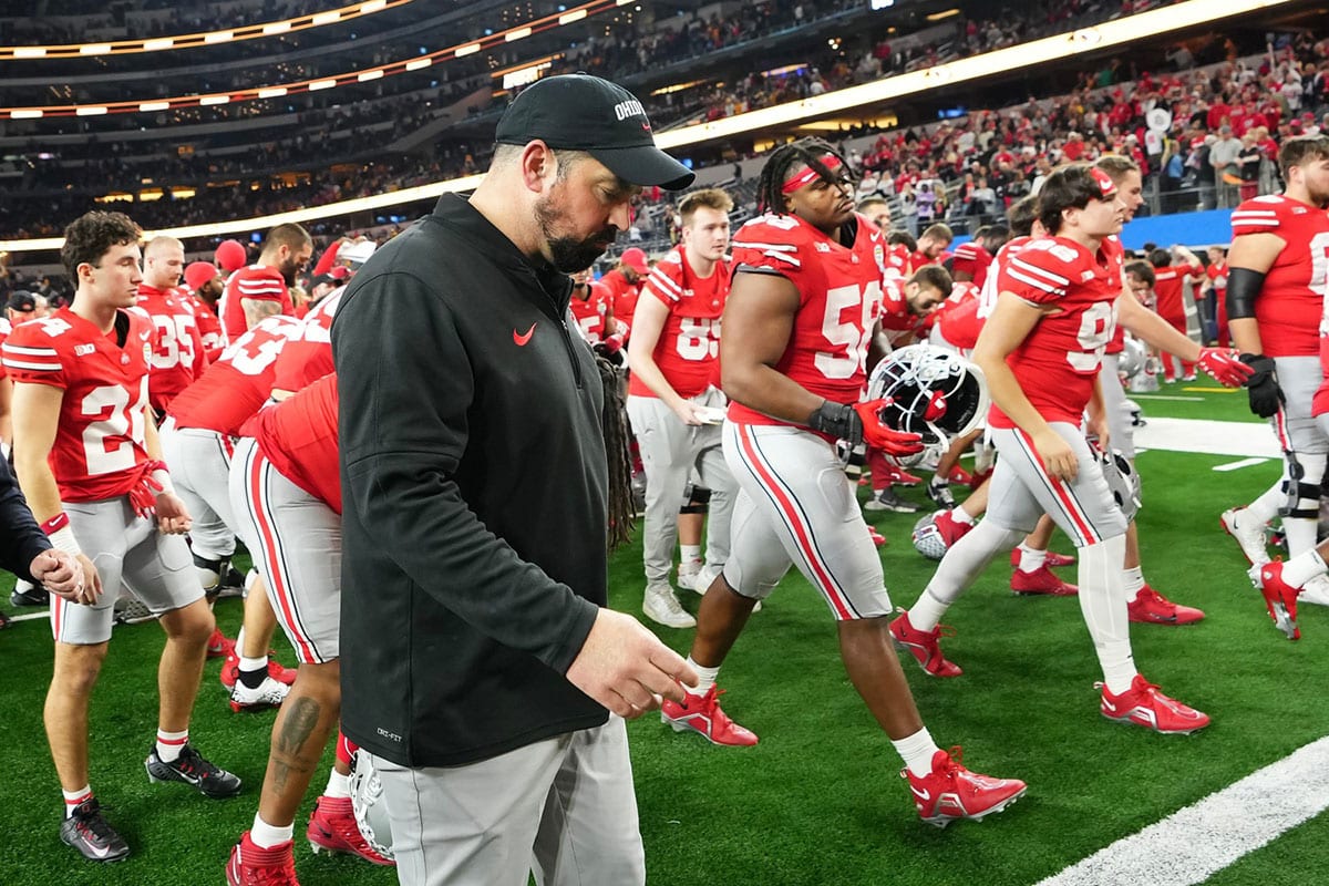 Ohio State Buckeyes head coach Ryan Day walks off the field following their 14-3 loss to the Missouri Tigers in the Goodyear Cotton Bowl Classic at AT&T Stadium.