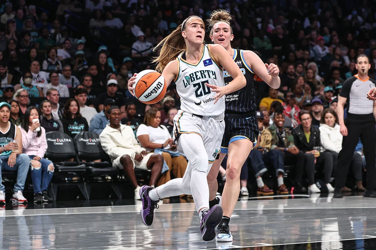 New York Liberty guard Sabrina Ionescu (20) drives past Chicago Sky guard Marina Mabrey (4) in the first quarter at Barclays Center.