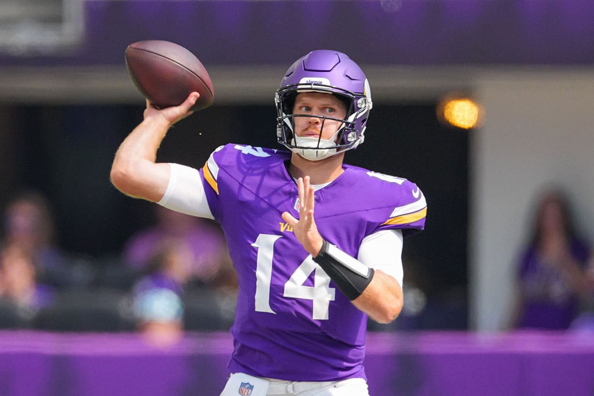 Minnesota Vikings quarterback Sam Darnold (14) passes against the Las Vegas Raiders in the first quarter at U.S. Bank Stadium.