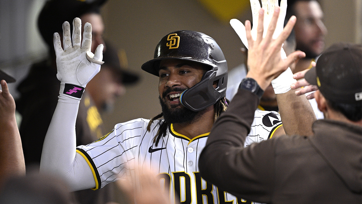 San Diego Padres right fielder Fernando Tatis Jr. (23) is congratulated in the dugout after hitting a home run against the Milwaukee Brewers during the fifth inning at Petco Park.