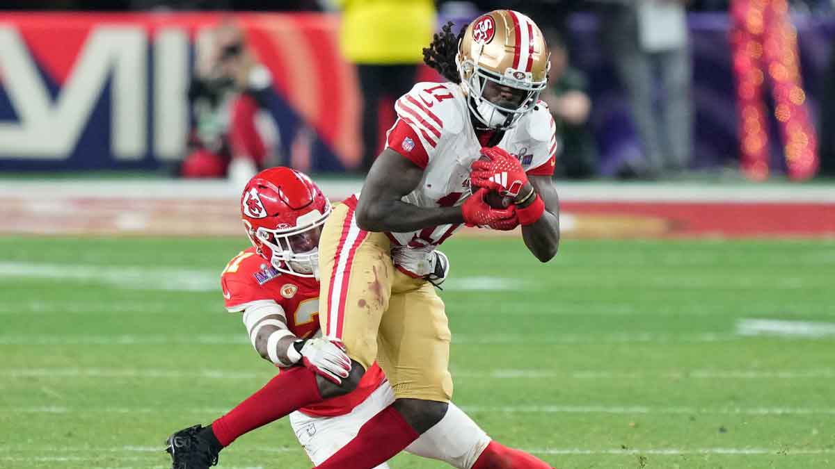 Kansas City Chiefs safety Mike Edwards (21) tackles San Francisco 49ers wide receiver Brandon Aiyuk (11) during overtime of Super Bowl LVIII at Allegiant Stadium. 