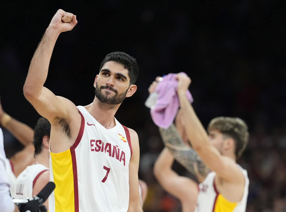 Spain small forward Santi Aldama (7) of the NBA celebrates after defeating Greece in a men's basketball group stage match during the Paris 2024 Olympic Summer Games at Stade Pierre-Mauroy.