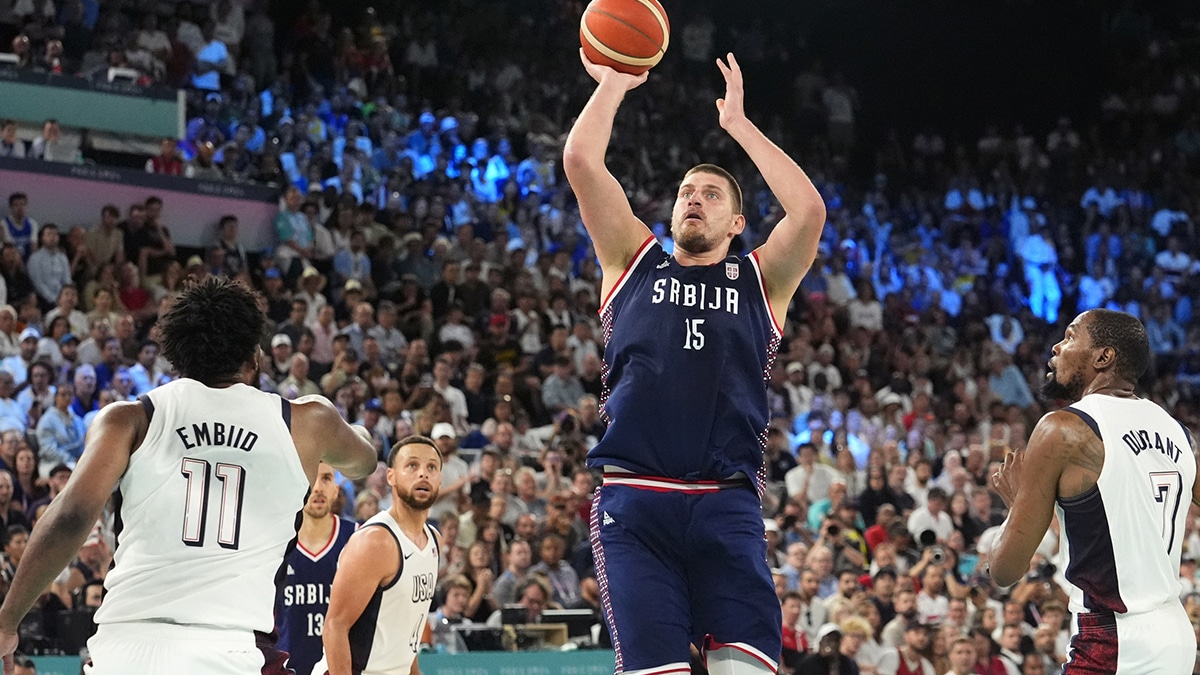 Aug 8, 2024; Paris, France; Serbia power forward Nikola Jokic (15) shoots the ball during the second half against the United States in a men's basketball semifinal game during the Paris 2024 Olympic Summer Games at Accor Arena. Mandatory Credit: Rob Schumacher-USA TODAY Sports