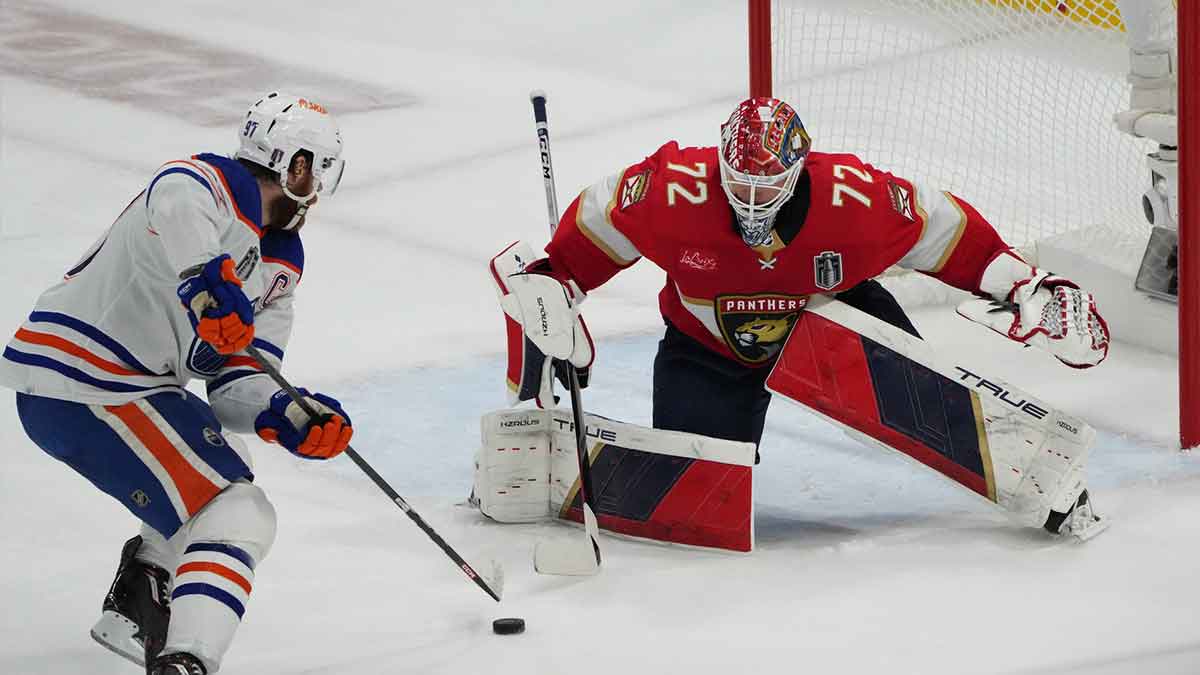 Florida Panthers goaltender Sergei Bobrovsky (72) defends against Edmonton Oilers forward Connor McDavid (97) during the third period in game seven of the 2024 Stanley Cup Final at Amerant Bank Arena