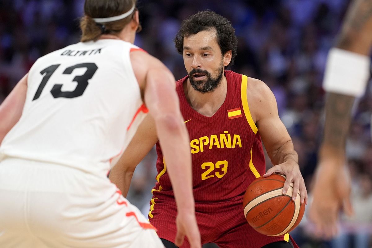 Spain guard Sergio Llull (23) controls the ball against Canada forward Kelly Olynyk (13) in the first half in a men’s group A basketball game during the Paris 2024 Olympic Summer Games at Stade Pierre-Mauroy.