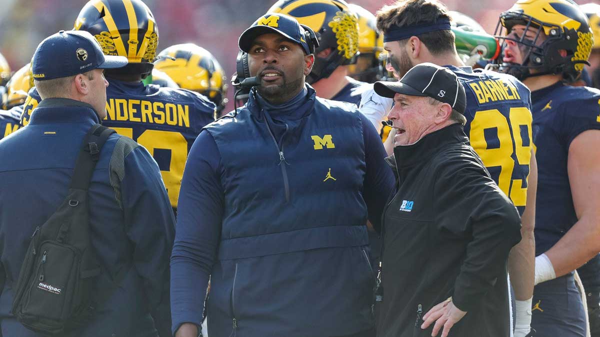 Michigan acting head coach Sherrone Moore watches a replay during the first half against Ohio State at Michigan Stadium
