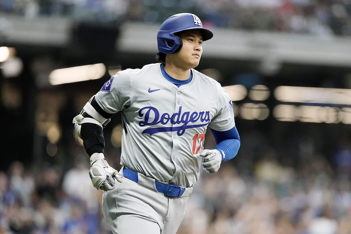 Aug 13, 2024; Milwaukee, Wisconsin, USA; Los Angeles Dodgers designated hitter Shohei Ohtani (17) rounds the bases after hitting a home run during the third inning against the Milwaukee Brewers at American Family Field. 